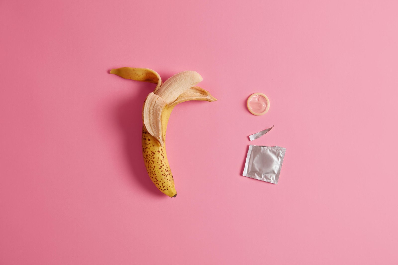 effective-preventing-pregnancy-product-your-safety-open-condon-package-with-banana.jpg
