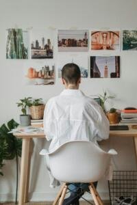 Adult content creator setting up an OnlyFans account on a laptop in a home office