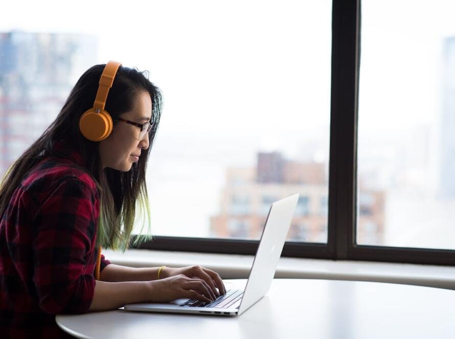 Adult content creator reading about the TAKE IT DOWN Act on a laptop