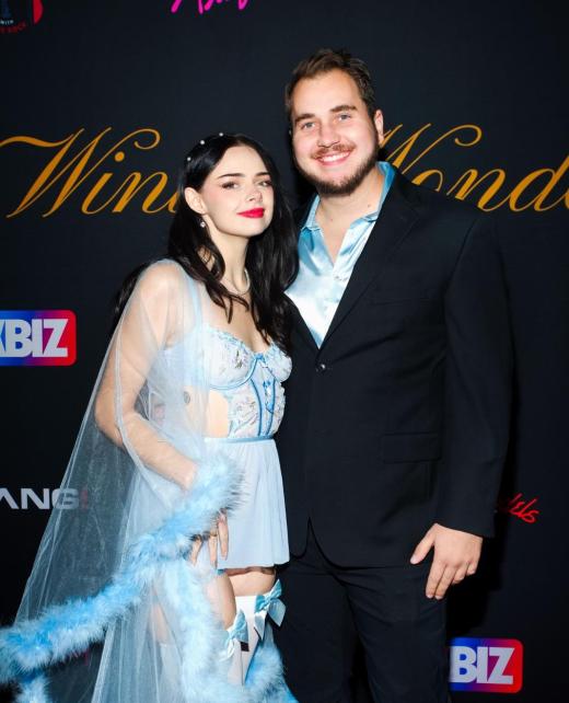 The Founders of AIU on the red carpet at an adult industry event, dressed in elegant attire, representing confidence and success in the industry.
